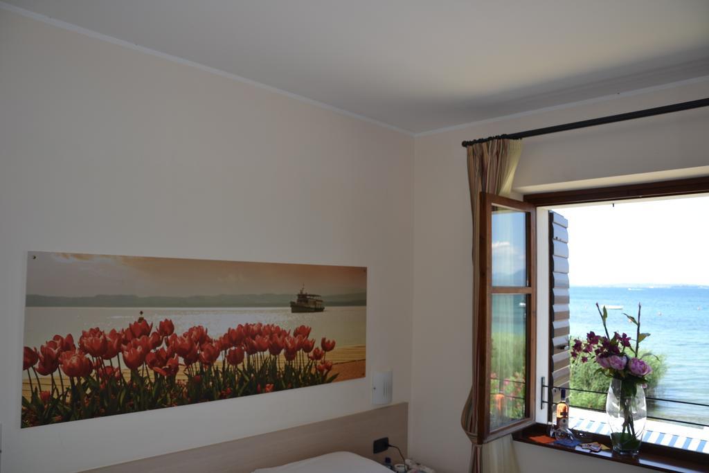 Locanda Le Palafitte Bardolino Rum bild